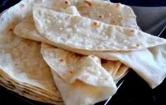 како