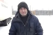 біля