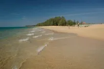 біля
