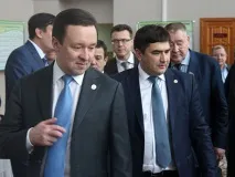 която
