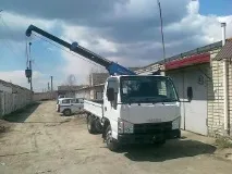 Isuzu Elf (Ісузу Ельф) технічні характеристики, історія розвитку, опис вантажівки, Все про ельф