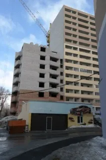 біля
