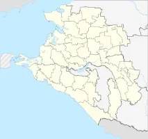 край