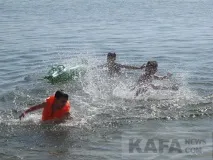 біля