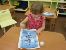 першій