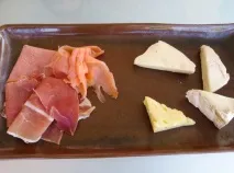 біля