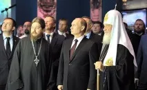 української