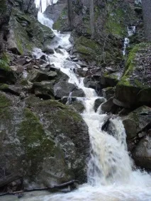край