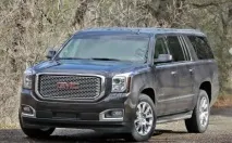 Огляд американського позашляховика GMC Yukon Denali 2015 з фото екстер’єру, інтер’єру, докладними. огляд
