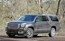Огляд американського позашляховика GMC Yukon Denali 2015 з фото екстер’єру, інтер’єру, докладними. 2015