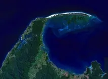 біля