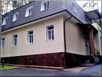 біля