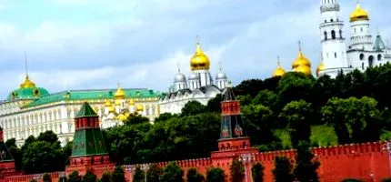 російській