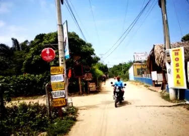 како