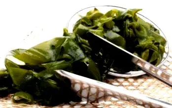 како