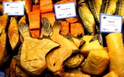 како
