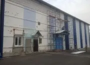 Обшивка фасаду профнастилом в Рязані будівлі