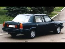 купує