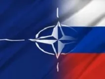 біля