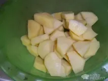 Рецепт Курка запечена з картоплею, У пакеті картоплею