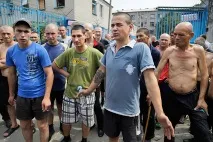 української