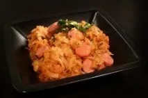 Тушкована капуста із сосисками капуста