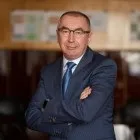 першим