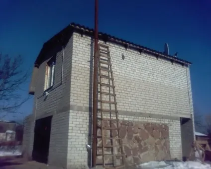 Двоповерховий гараж фото