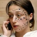 Фото тату на обличчі