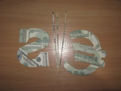 Букет для чоловіка з цукерок і пляшки коньяку (букет) Букет для чоловіка з цукерок і пляшки коньяку