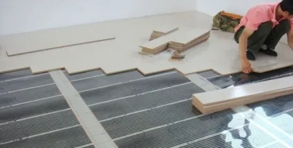 Електрична тепла підлога під ламінат види, ціна, який краще вибрати, монтаж своїми руками