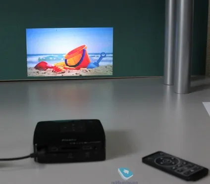 Огляд кишенькового мультимедійного центру (проектора) philips picopix
