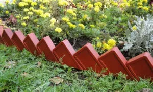 Як зробити декоративний паркан для клумби своїми руками фото і відео інструкція (зробити) Як зробити декоративний паркан для клумби своїми руками фото і відео інструкція