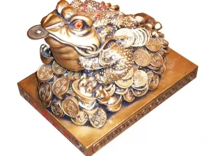 Trohnogaya жаба с монета в устата, за да се привлекат богатство