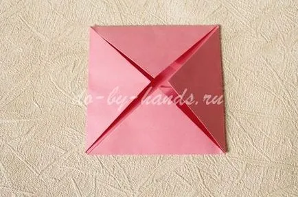 Tavirózsa egy papírt a kezét a művészet origami