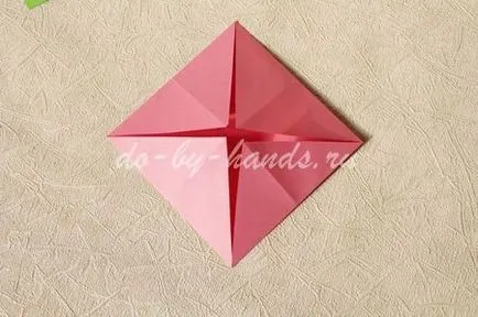 Tavirózsa egy papírt a kezét a művészet origami