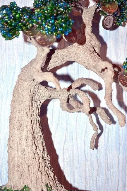 Zöld bonsai bead pénzt fa kezével