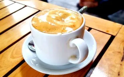 како