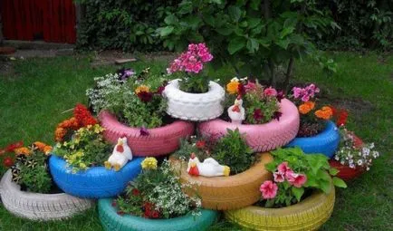 Un pat de flori a anvelopei cu mâinile (pat de anvelope cu propriile lor mâini paturi de flori ale anvelopei cu mâinile pentru a crea paturi originale de anvelope cu mâinile lor) Un pat de flori de anvelope cu propriile lor mâini