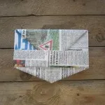 Capacul de ziar cu un vizor