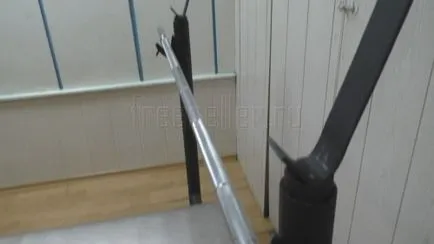 A recepció a rúd a kezét