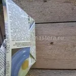 A kupak az újság egy üveggel