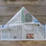 A kupak az újság egy üveggel