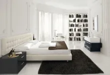 Dormitoare în design alb-negru, cu o fotografie a interiorului, tonuri de mobilier cu accente luminoase, stil și căști